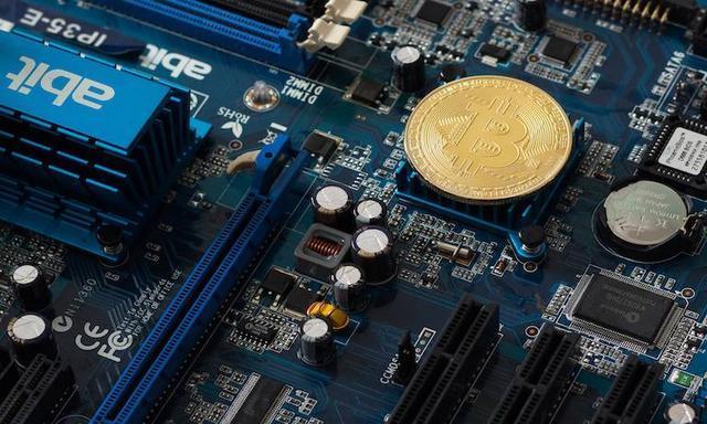 A close-up view of a Goldshell mining rig, highlighting its compact design and specialized hardware.